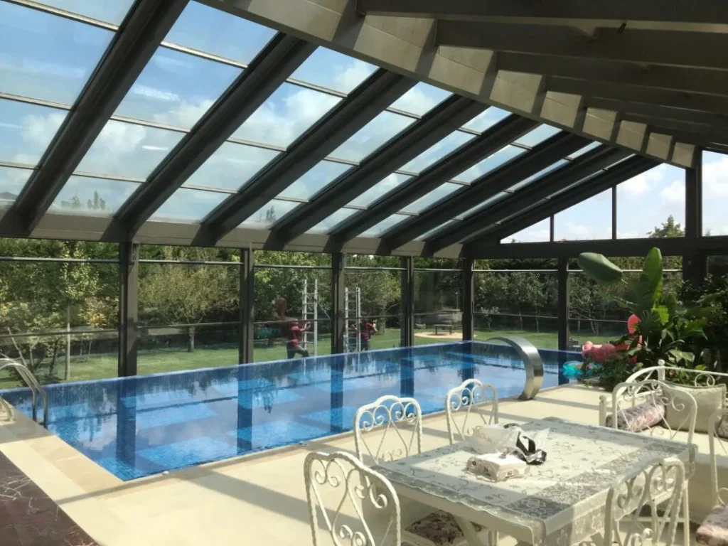 Sliding-Glass-Roof-Systems_retractable-glass-roof-movable-swimming-pool-enclosure-system-in-UK